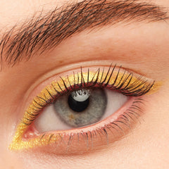 Black on Black BFF Mascara coats and separates lashes on a grey eye, paired with metallic gold eyeliner and a natural brow, highlighting the deep black finish of ColourPop BFF Mascara.