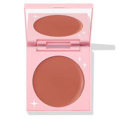 Bali Baby ColourPop Cream Blush opens to reveal a matte rosy-nude pan in a light pink compact with white star accents and a built-in mirror, studio-lit on a white background.