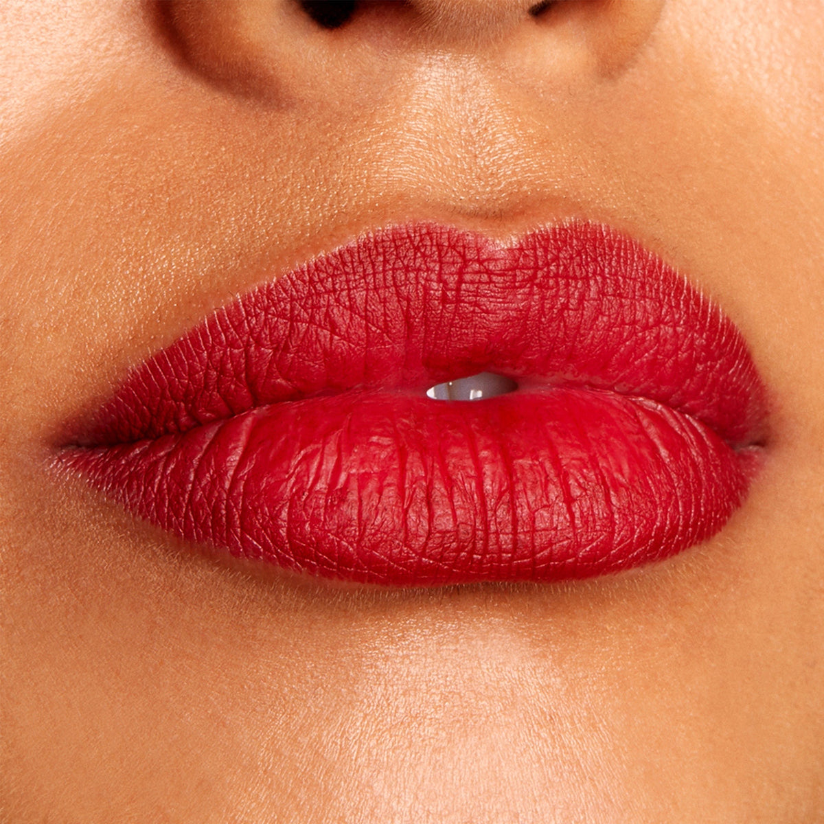 Lips wearing Bichette ColourPop Lippie Pencil, precisely lined and fully filled in a deep, cool-toned cherry red with a velvety matte finish, shown in an extreme close-up beauty swatch highlighting rich pigment, smooth texture, and crisp edges.