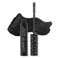 ColourPop BFF Mascara Black on Black displayed open, wand upright showing dense bristle brush, with a bold black swatch behind; sleek black tube reads Volumizing Mascara and cap features white heart, star, and smiley icons.