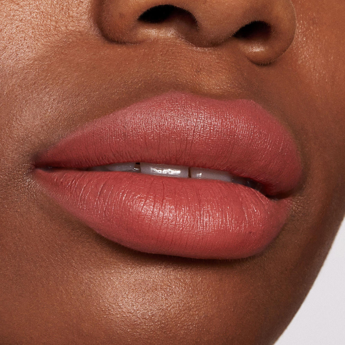 Brink ColourPop Lippie Pencil lining and filling lips in a warm rosy terracotta nude, delivering precise, full-coverage color with a soft matte finish in a close-up beauty swatch of the lip liner’s smooth, feather-free payoff.