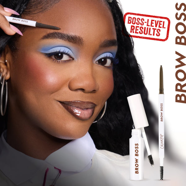 Woman with bold blue eyeshadow shapes her eyebrow with the Brow Boss brow pencil while Brow Boss brow gel and pencil from ColourPop are shown beside her against a white background with the phrase “Boss-Level Results.”