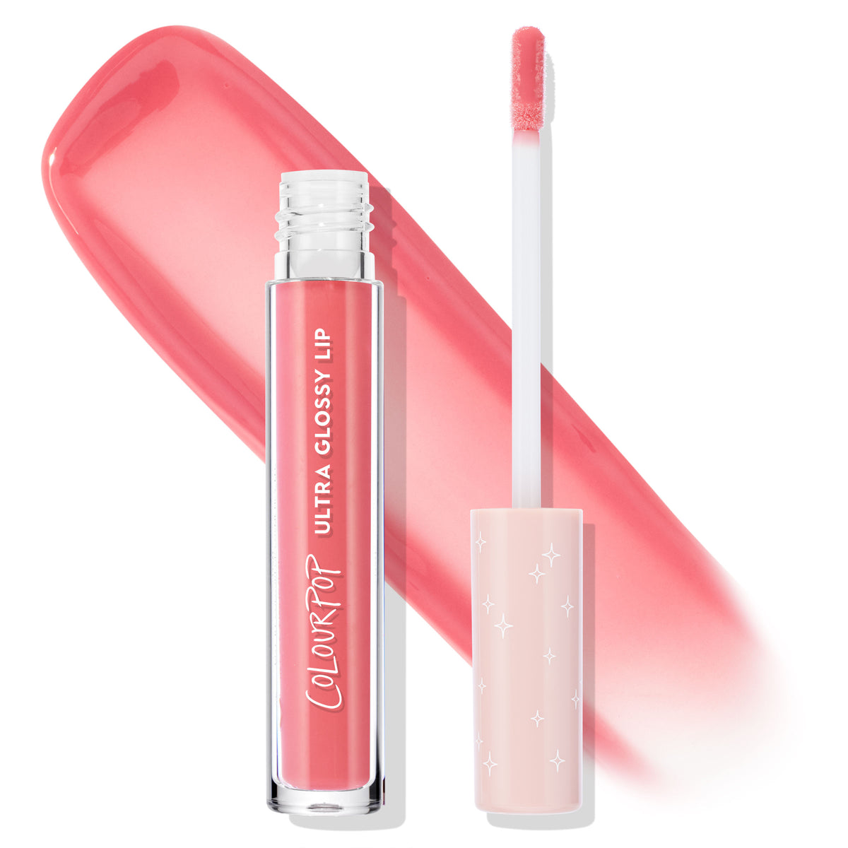 ColourPop Ultra Glossy Lip in Bubblegum standing next to its doe-foot applicator, both uncapped, with a sheer bubblegum-pink swatch behind; clear tube displays the gloss and a pale pink cap with tiny star accents on a white background.