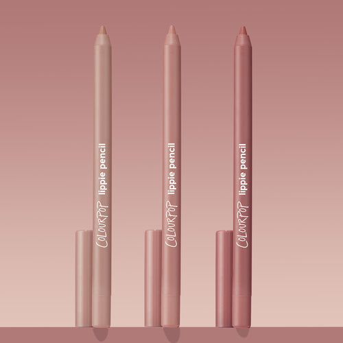 Trio of ColourPop Lippie Pencil Cool Besties standing upright, tips exposed, in light nude, pink nude, and rosy mauve tones with matching caps, arranged on a blush gradient background for a clean product shot.