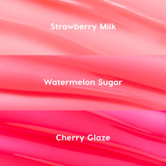 Fruit Basket ColourPop Glossy Lip Balm Trio swatches display three glossy shades - Strawberry Milk (soft baby pink), Watermelon Sugar (juicy coral), and Cherry Glaze (vivid hot pink) - shown as smooth, lacquered stripes in a close-up texture.