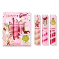 Merry Grinchmas Swirl Lip Gloss Kit by ColourPop showcasing three swirl lip glosses - nude gold, pink, and red with white - set beside a pink holiday box featuring The Grinch, Max, and Cindy-Lou Who graphics for a festive gift-ready look.