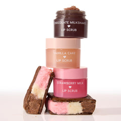 Neapolitan Sundae ColourPop Lip Scrub trio - Strawberry Milk, Vanilla Cake, and Chocolate Milkshake - stacked with the top jar open to show scrub texture, flanked by Neapolitan ice cream sandwiches on a white background.
