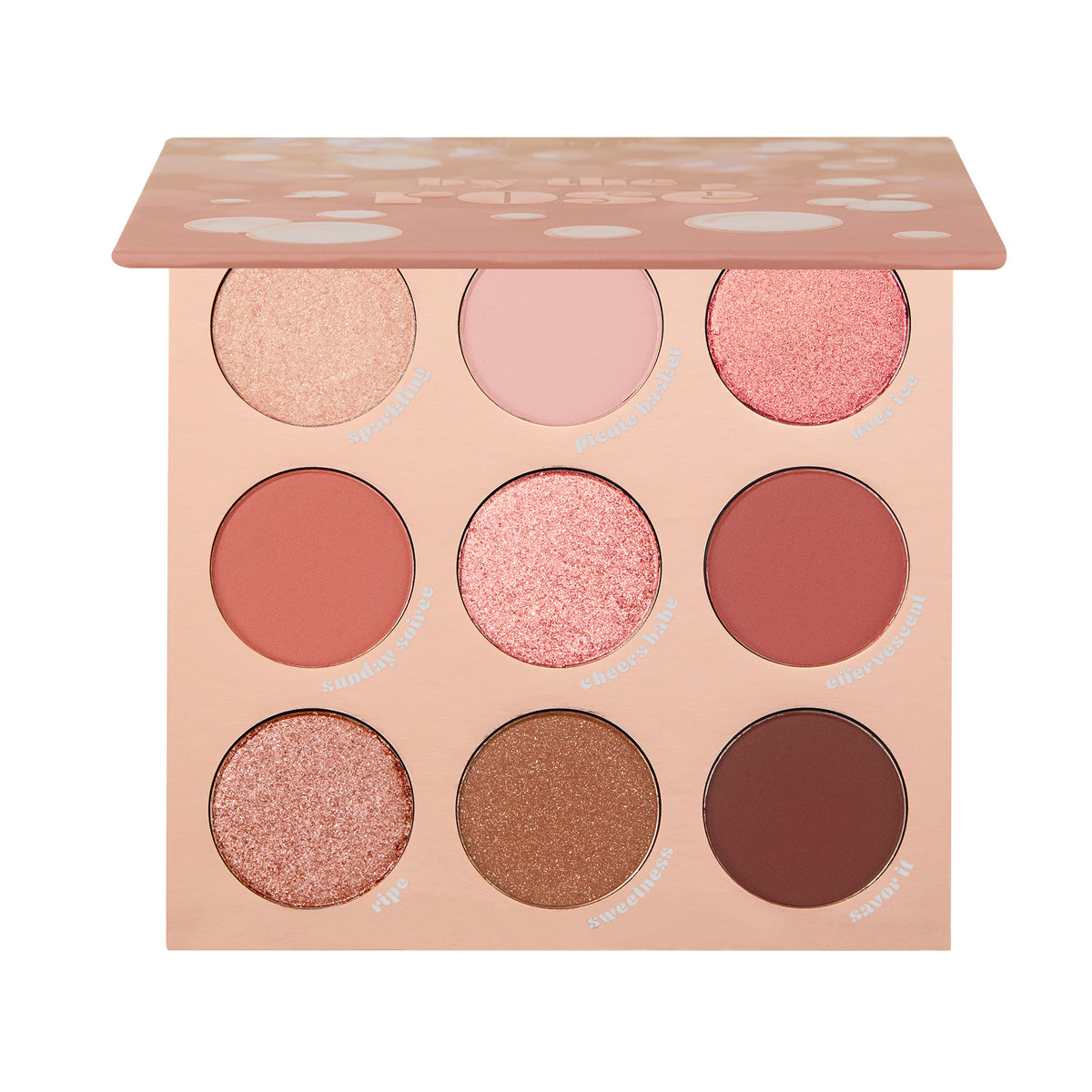 By The Rosé ColourPop Shadow Palette showcasing nine rose and neutral eyeshadows - matte and shimmer - in a blush-pink compact with a half-open lid on white; shades like Sparkling, Picnic Basket, Over Ice, Sweetness, and Savor It.