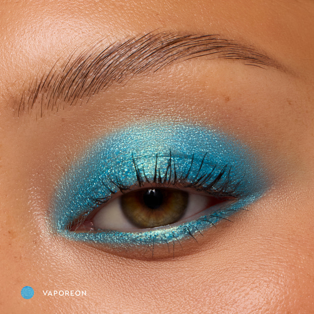 Close-up of a medium-skin eye wearing Vaporeon bright aqua shadow stick