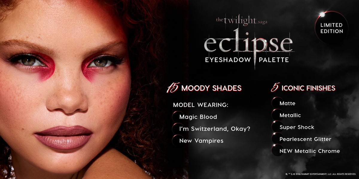 Model wearing dramatic red and black eye makeup poses beside promotional text for The Twilight Saga Eclipse Eyeshadow Palette, a limited edition 15-shade palette with five finishes including matte, metallic, Super Shock, pearlescent glitter, and metallic chrome.
