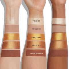 Precious Metals ColourPop Shadow Palette swatched on three arms, showcasing shades Polished, Too Much, Strike Gold, Brass Act, and Down to Earth in champagne, nude, gold, bronze, and deep brown mattes and metallics across light to deep skin tones.
