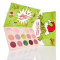 ColourPop How the Grinch Stole Christmas shadow palette showcasing 15 festive matte, shimmer, and glitter shades, opened to reveal pink pans beside bright green holiday packaging with the Grinch in a Santa hat and Whoville artwork.