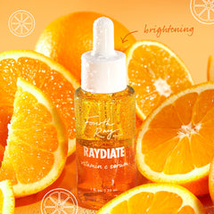 Fourth Ray Beauty Raydiate Vitamin C Serum 1 fl oz dropper bottle glistens with dew among fresh orange slices on a bright citrus background, highlighting brightening in the Get That Glow ColourPop Face Set.