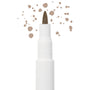 Soft Brown freckle pen by Colourpop with a fine felt tip applying natural soft brown dots, shown close up against a white background to highlight precise faux freckle makeup for the face.