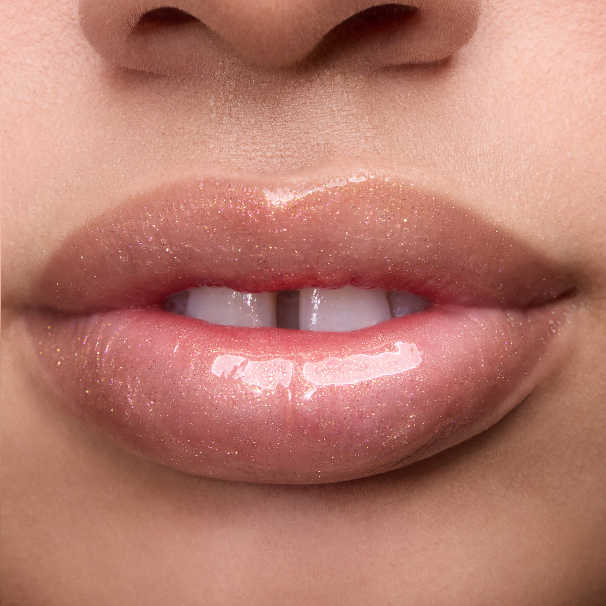 Close-up of models’ lips wearing Colourpop Fresh Kiss Glossy Balm in Buttery Pancakes, showing sheer pink shimmer Lip Gloss & Lip Oil finish on different skin tones against a plain background.