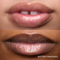 Close-up of two models’ lips wearing Colourpop Fresh Kiss Glossy Balm in Buttery Pancakes, showing sheer pink shimmer Lip Gloss & Lip Oil finish on different skin tones against a plain background.