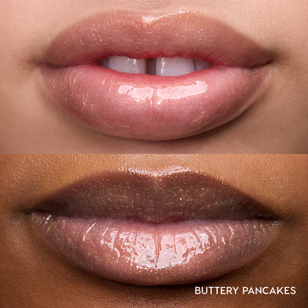 Close-up of two models’ lips wearing Colourpop Fresh Kiss Glossy Balm in Buttery Pancakes, showing sheer pink shimmer Lip Gloss & Lip Oil finish on different skin tones against a plain background.