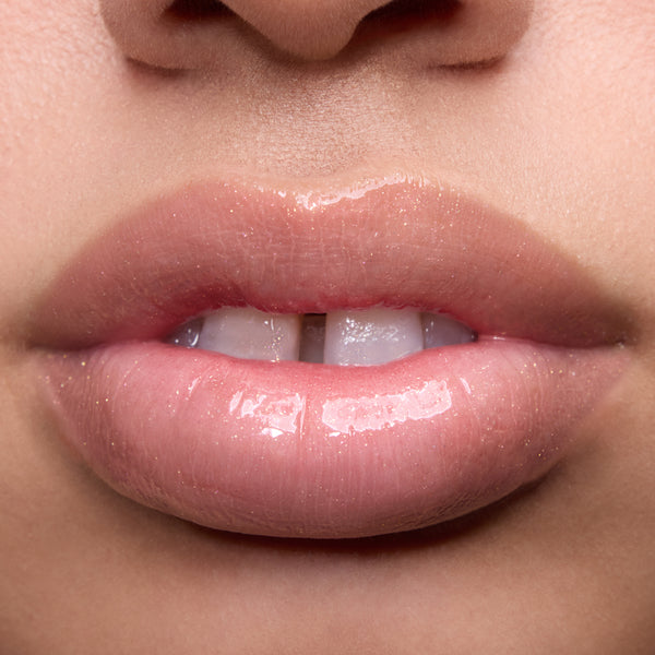 Close-up swatches of Colourpop Peach Mochi Fresh Kiss Glossy Balm on models’ lips, showing sheer peachy shimmer and high-shine finish, highlighting how this Lip Gloss & Lip Oil hybrid looks on different skin tones.