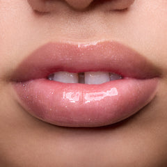 Close-up of models’ lips wearing Colourpop Fresh Kiss Glossy Balm in Raspberry Crème, showing sheer pink shimmer Lip Gloss & Lip Oil finish on different skin tones against a simple studio background.