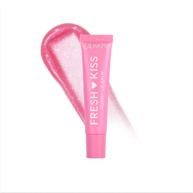 Colourpop Raspberry Crème Fresh Kiss Glossy Balm standing upright against a white background, showing its bright pink squeeze tube packaging and bold white logo, promoting hydrating Lip Gloss & Lip Oil shine for soft, glossy lips.