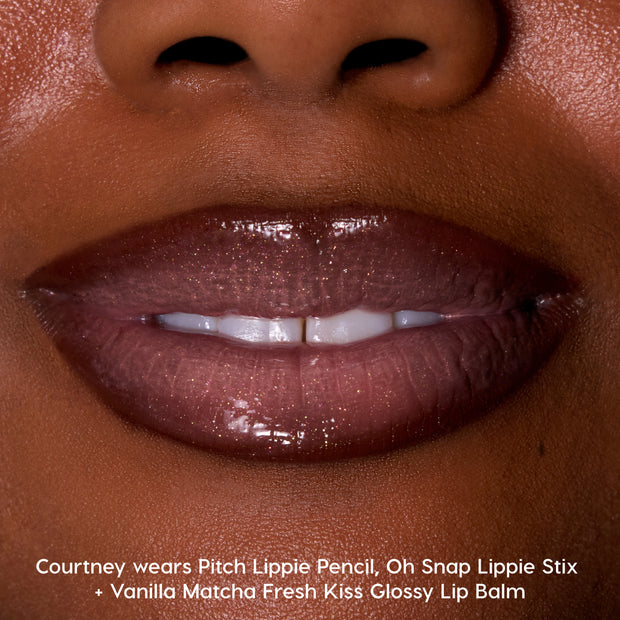 Close-up of glossy, shimmer-coated lips wearing Colourpop Vanilla Matcha Fresh Kiss Glossy Balm, showcasing rich brown shine and smooth hydration for lip gloss & lip oil fans on medium-deep skin tone.