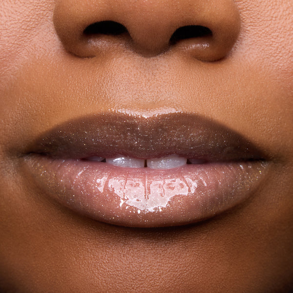 Close-up of models’ lips wearing Colourpop Fresh Kiss Glossy Balm in Whipped Cream, showing sheer nude shine and shimmer finish, highlighting Lip Gloss & Lip Oil texture on different skin tones against a plain background.