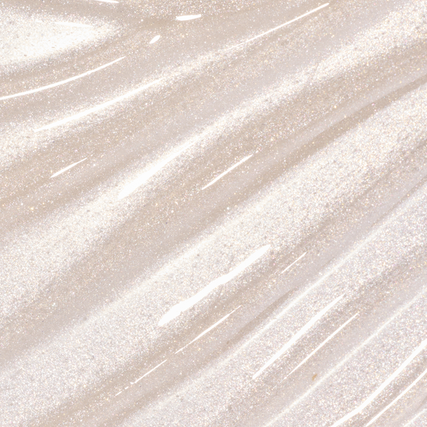 ColourPop Fresh Kiss Glossy Balm in Whipped Cream swatched as smooth, streaked layers of sheer opal gloss with fine silver and pink sparkle, showcasing the shimmering Lip Gloss & Lip Oil texture against a light background.