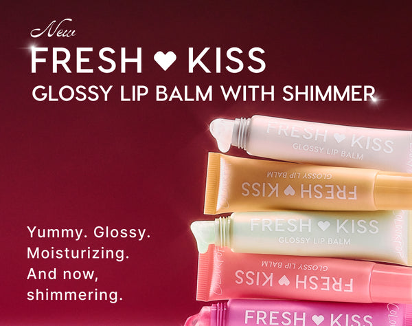 Fresh Kiss glossy lip balm with shimmer tubes stacked in pastel colors on a deep red background, showcasing moisturizing, yummy, shimmering lip balm for a high-shine finish in multiple shades.