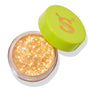 Open jar of ColourPop Glitter Gel, Ogres are Like Onions, shimmering with dense iridescent gold‑peach glitter flakes, rests on a white background with a lime green cap featuring an orange “S” set ajar.