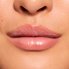 Glossy lips wearing a sheer pink tint, demonstrating the Fruit Basket ColourPop Glossy Lip Balm Trio with high-shine, cushioned moisture and smooth texture; macro close-up in studio lighting highlights hydrated, natural-looking lips.