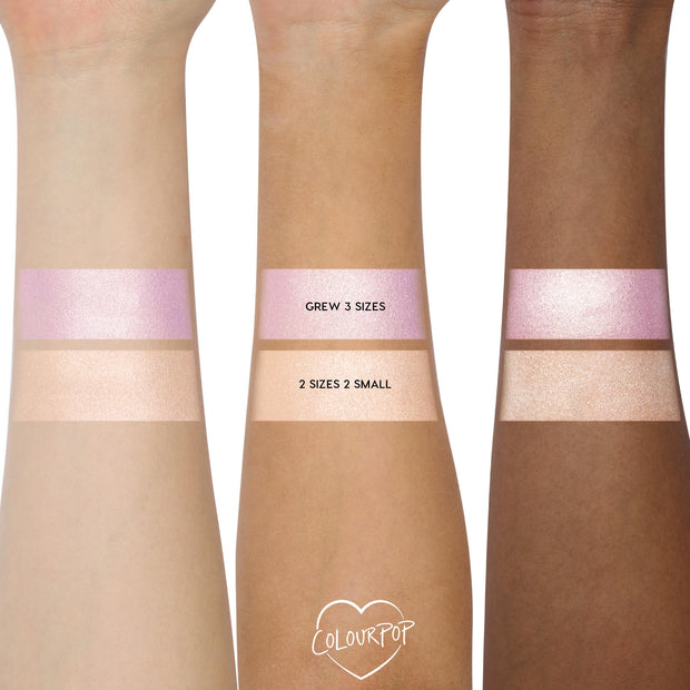 Change of Heart Super Shock Highlighter Kit by ColourPop swatched on three arms, showing icy pink-lavender “Grew 3 Sizes” and champagne-peach “2 Sizes 2 Small,” each shimmering across fair, medium, and deep skin tones.