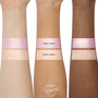 Change of Heart Super Shock Highlighter Kit by ColourPop swatched on three arms, showing icy pink-lavender “Grew 3 Sizes” and champagne-peach “2 Sizes 2 Small,” each shimmering across fair, medium, and deep skin tones.
