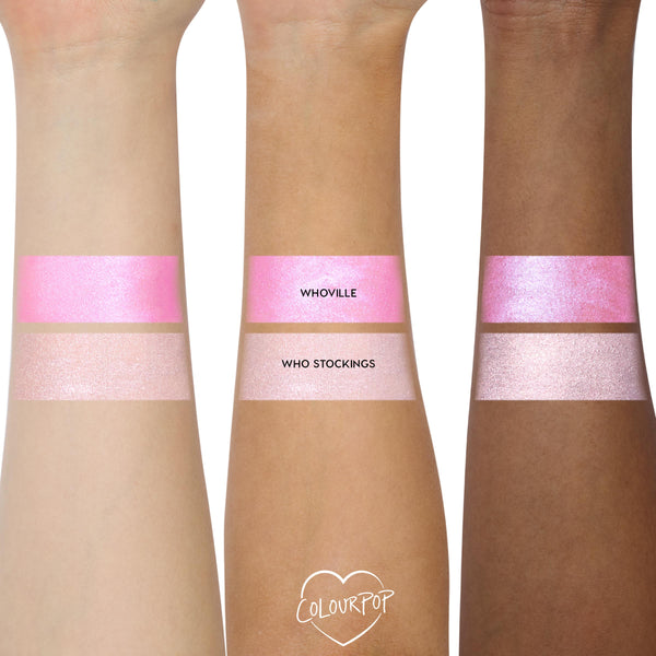 ColourPop Liked Christmas a Lot… Shadow Stix Set swatches, showing Whoville (vivid shimmery pink) and Who Stockings (pale pink shimmer) applied in wide bands on three forearms across light, medium, and deep skin tones.