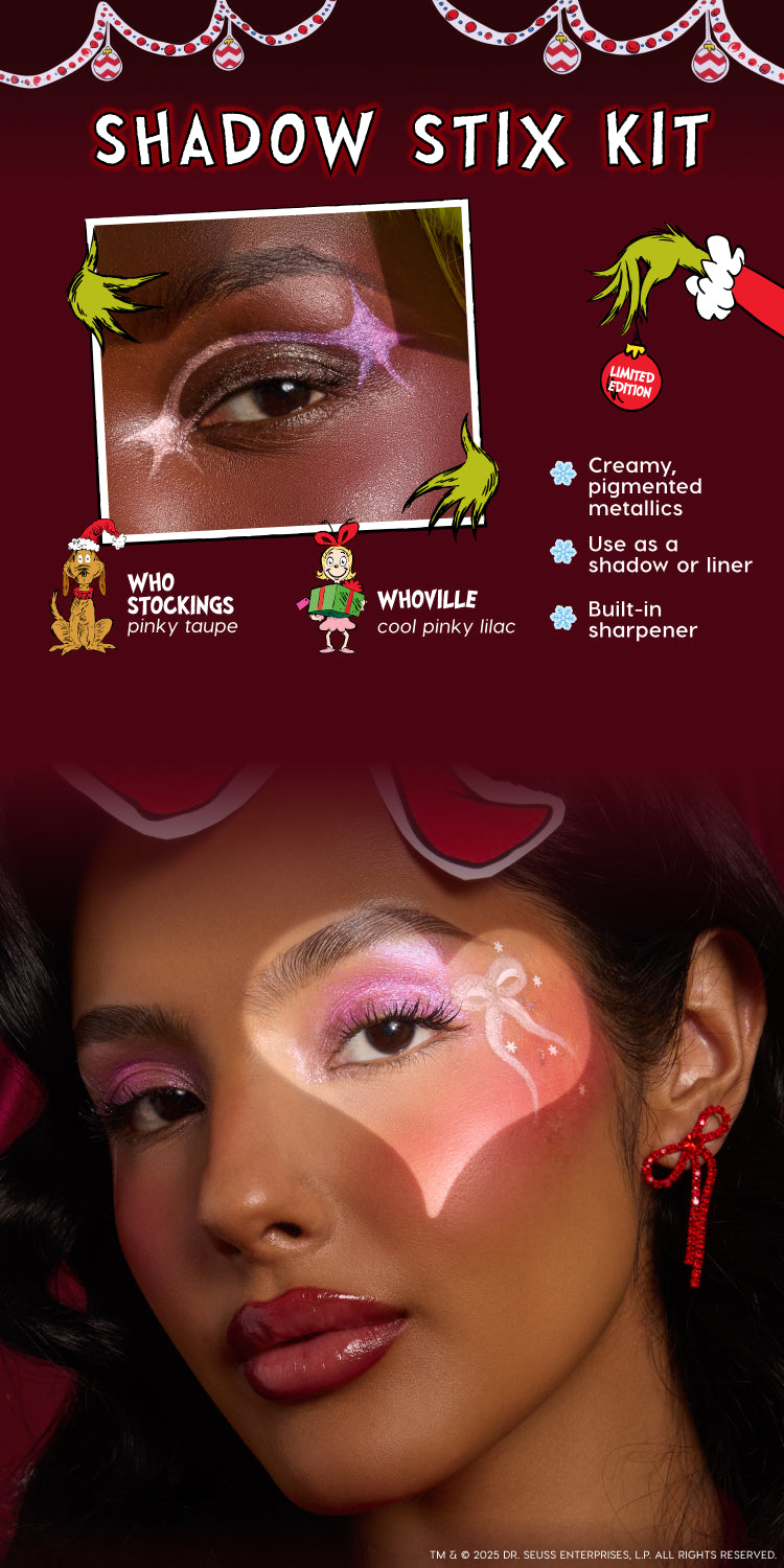 Model wears Colourpop Grinch Shadow Stix Kit eye look in shimmery pinky taupe Who Stockings and cool pinky lilac Whoville shades, showcasing creamy metallic holiday shadow-liner sticks with built-in sharpener on festive red backdrop.