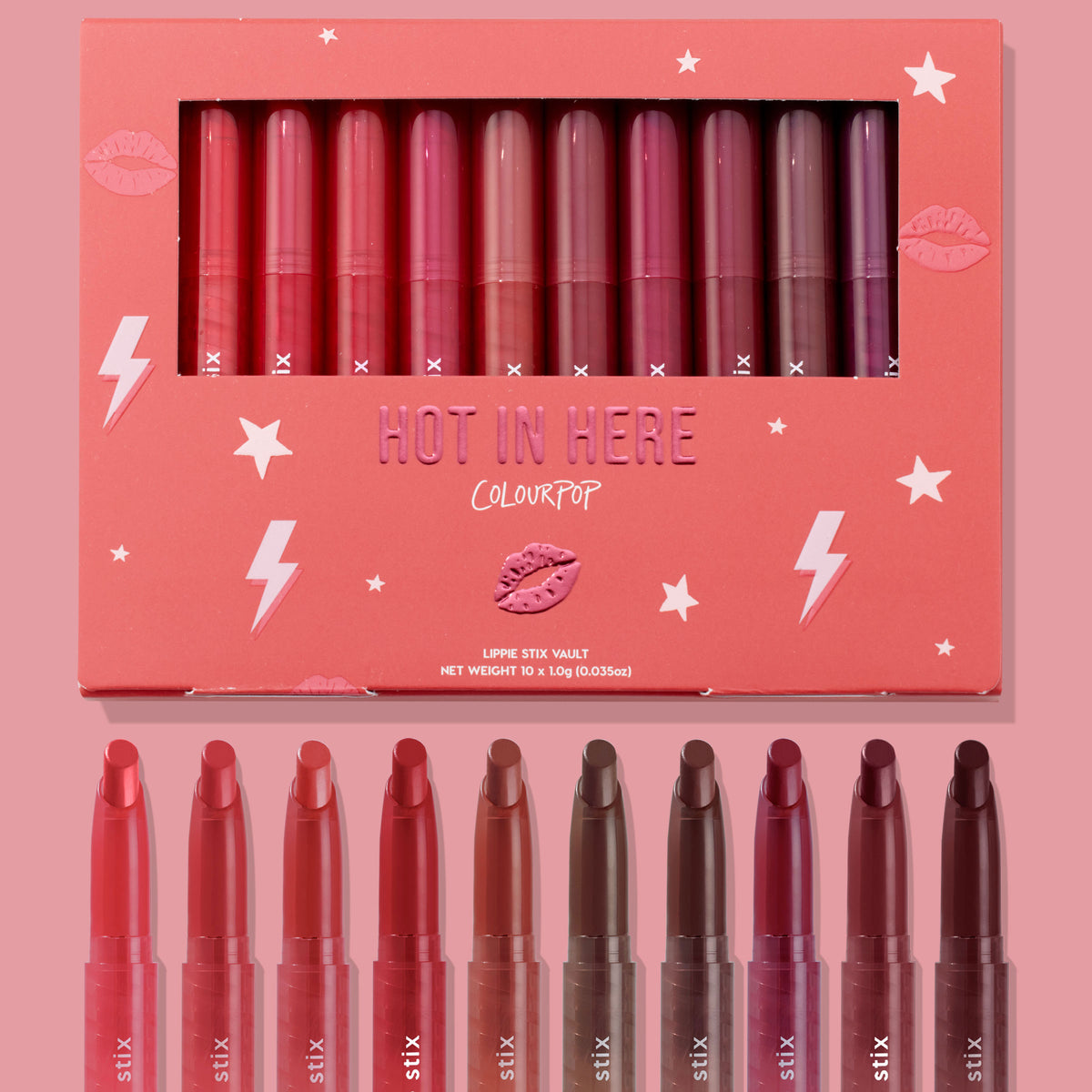 Hot in Here ColourPop Lippie Stix vault showcasing 10 creamy shades - from rosy pinks and corals to berries and deep browns - arranged in a coral box with star and lightning graphics, windowed lid, and matching bullet tips displayed below.
