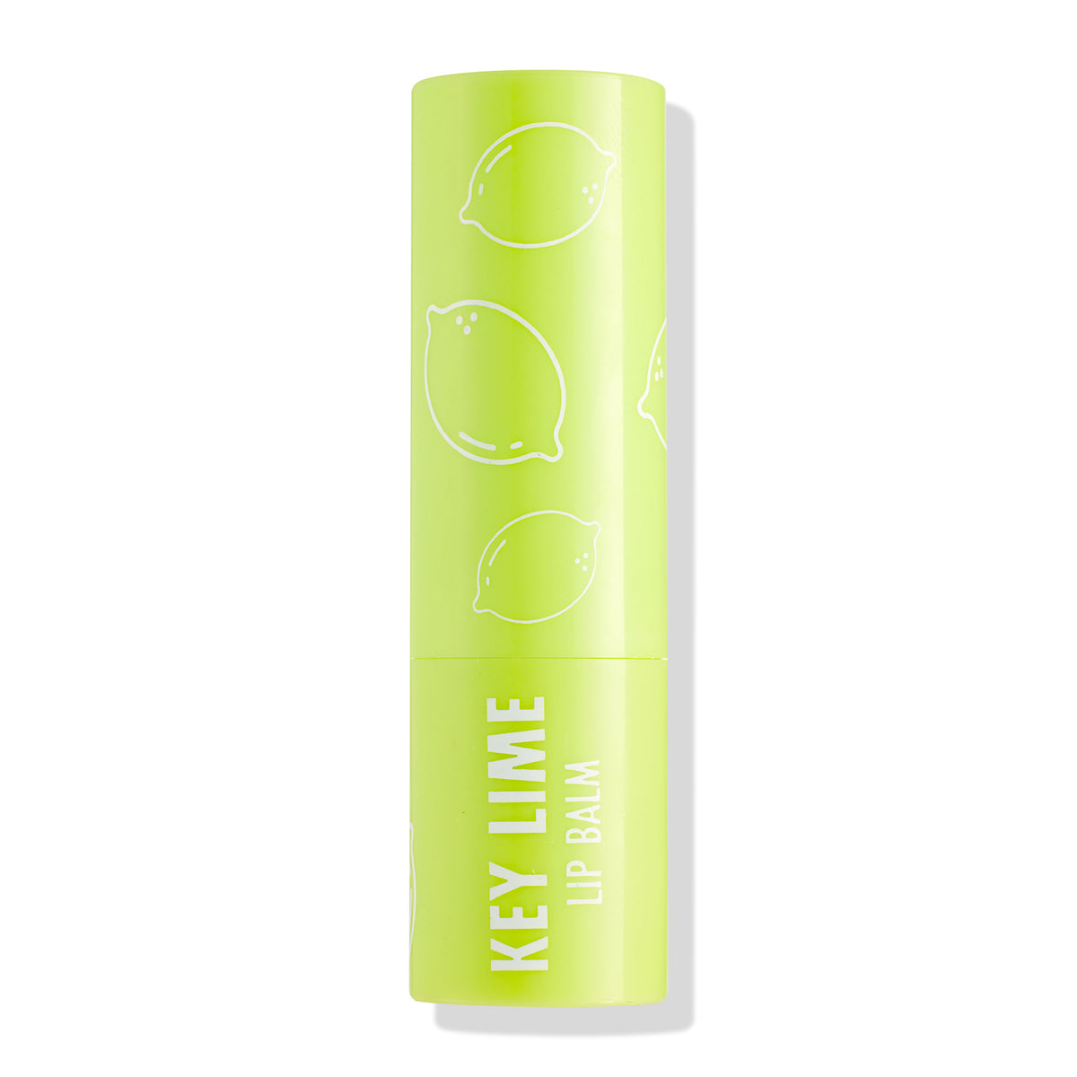 ColourPop Lip Balm tube in Key Lime standing upright with cap on, showcasing a bright lime‑green case with white lime illustrations and “KEY LIME LIP BALM” text, photographed isolated against a clean white background.