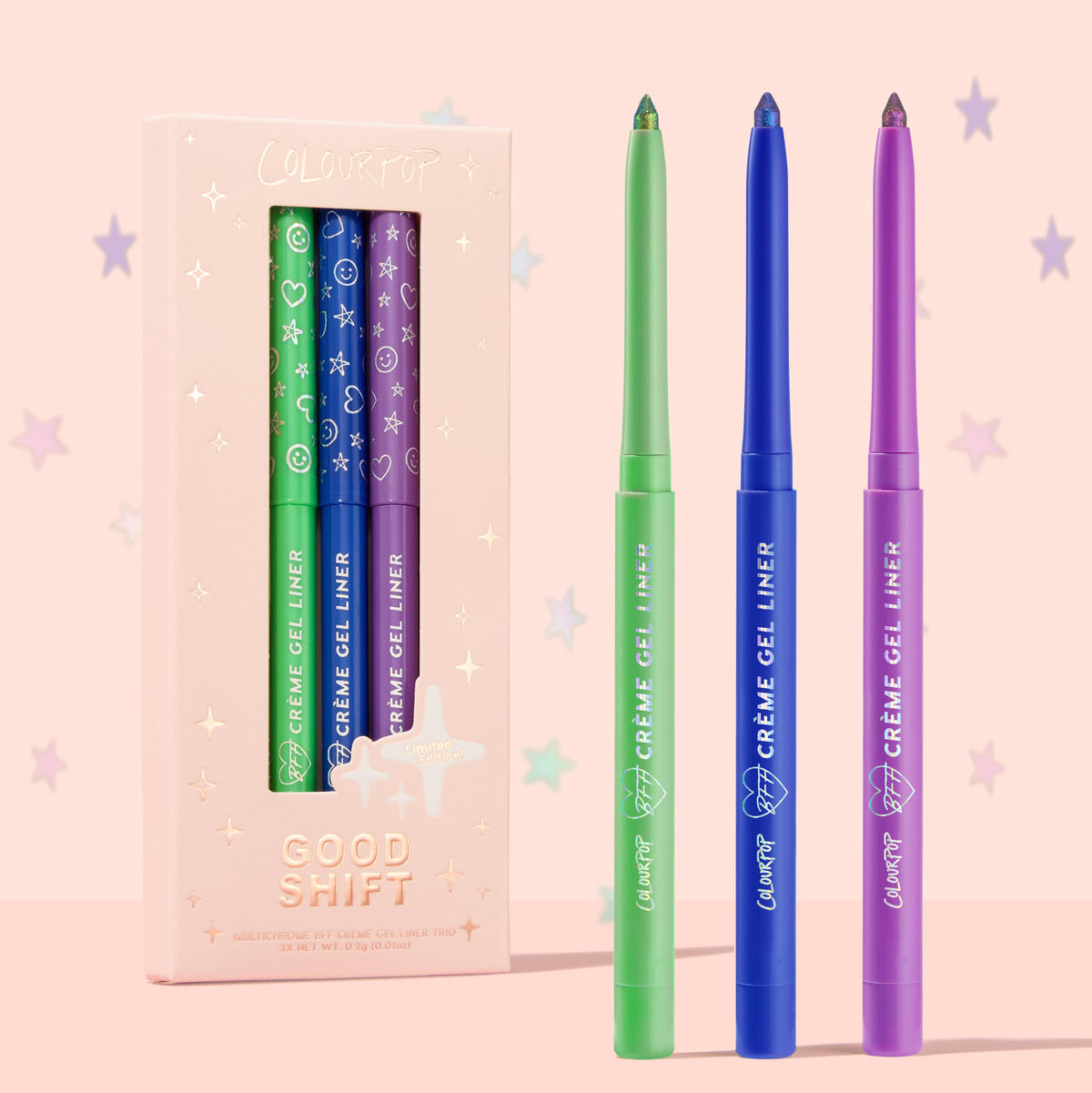 ColourPop Crème Gel Liner Good Shift trio standing uncapped, showcasing green, blue, and purple shimmer tips beside a blush-pink starry box labeled Good Shift Limited Edition; vibrant long-wear crème gel eyeliner set for bold eye looks.