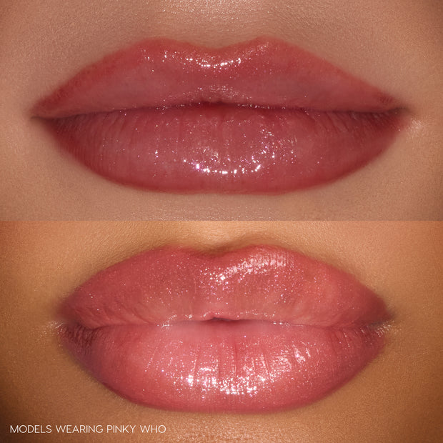 Glossy close-up lips wearing the Pouty Grinch lip set by ColourPop, showcasing the Pinky Who shade - a sheer rosy-pink shimmer - on two models with light to medium skin tones, highlighting a high-shine, hydrated finish in a studio close-up.