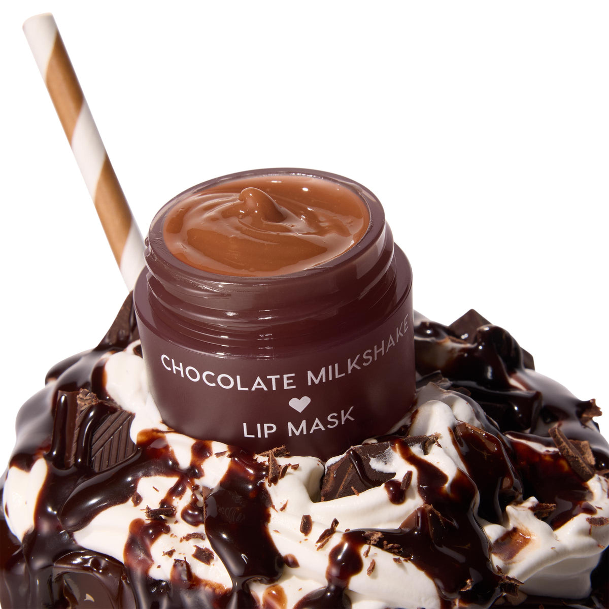 Chocolate Milkshake ColourPop Lip Mask jar sits open, revealing a glossy caramel-brown formula, resting atop whipped cream drizzled with chocolate and dotted with chunks, with a striped straw, showcasing a dessert-inspired hydrating lip treatment.