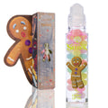 Gumdrop Buttons ColourPop Candy Lip Oil displayed with rollerball applicator, clear tube featuring pastel gumdrop visuals and a smiling gingerbread man, set beside a Shrek collab box with cookie-shaped cutout.