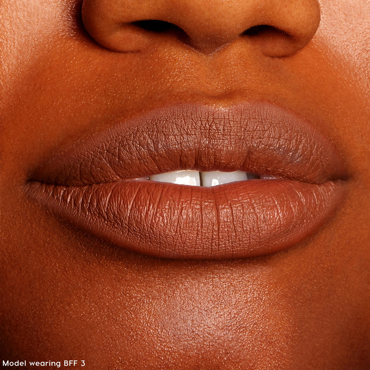 Lips lined and filled with ColourPop Lippie Pencil in BFF 3, showcasing a warm brown matte finish; close-up swatch for The Lil Box of Lippie Pencils under studio lighting, highlighting smooth texture and precise outline.
