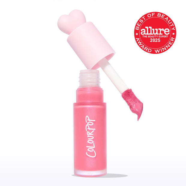 ColourPop Liquid Blush Princess Ave displays a frosted pink tube with COLOURPOP logo as the doe-foot applicator lifts a creamy rosy-pink swipe, topped by a heart-shaped cap, with a 2025 Allure Best of Beauty award badge on a white backdrop.