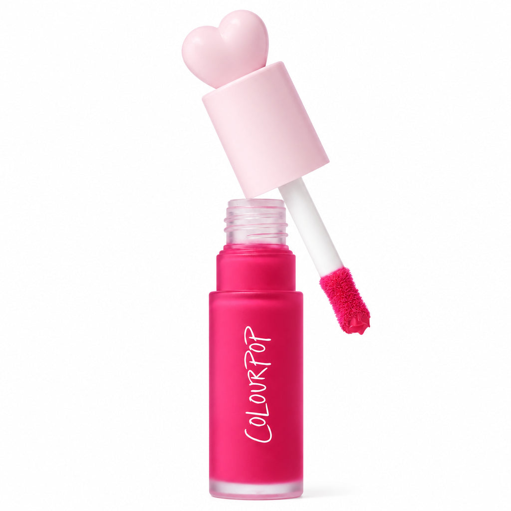 ColourPop Liquid Blush in Wildest Dreams, cap off - heart-shaped pale pink cap and doe-foot applicator hovering over a frosted hot pink bottle, with an Allure Best of Beauty 2025 award badge on the right against a white background.