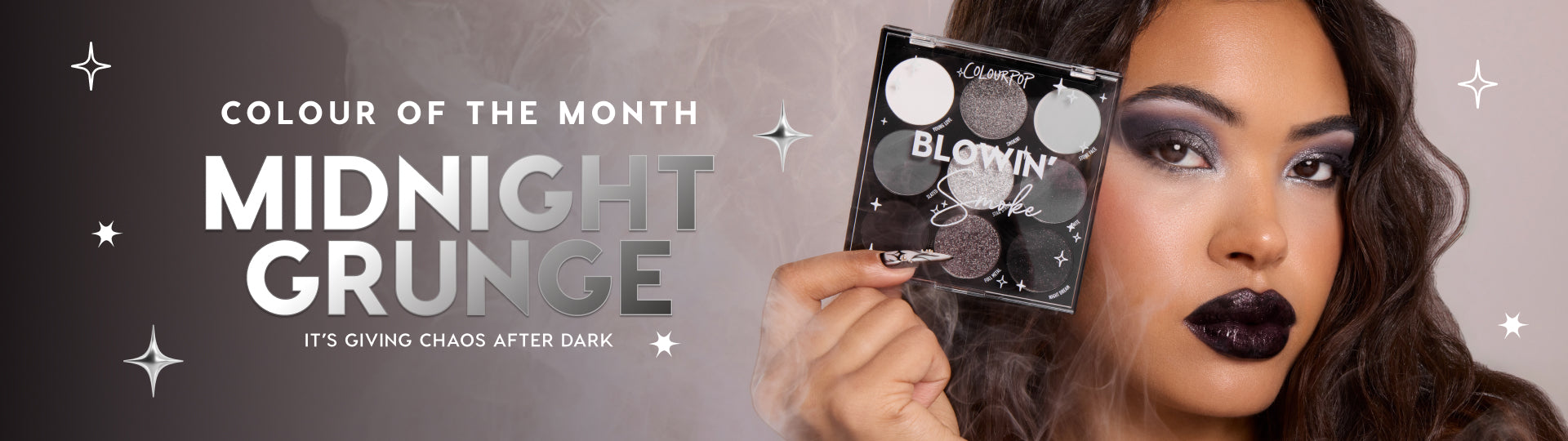 ColourPop Blowin’ Smoke nine-pan eyeshadow palette held beside a model’s face, showcasing a midnight grunge look with silver and charcoal smoky eyes and glossy black lips against a starry, hazy banner labeled Colour of the Month.