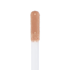 Doe-foot applicator coated in Major Throwback Ultra Glossy Lip, a warm nude-beige gloss with fine shimmer reflecting light for a high-shine finish, shown in a clean macro on white; ColourPop Ultra Glossy Lip.