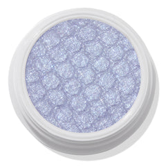 ColourPop Moon Daisy Super Shock Shadow shimmering in an open white pot; an icy lavender-lilac eyeshadow with silver microglitter and a dimpled, bouncy texture, shown close-up on a clean white background.