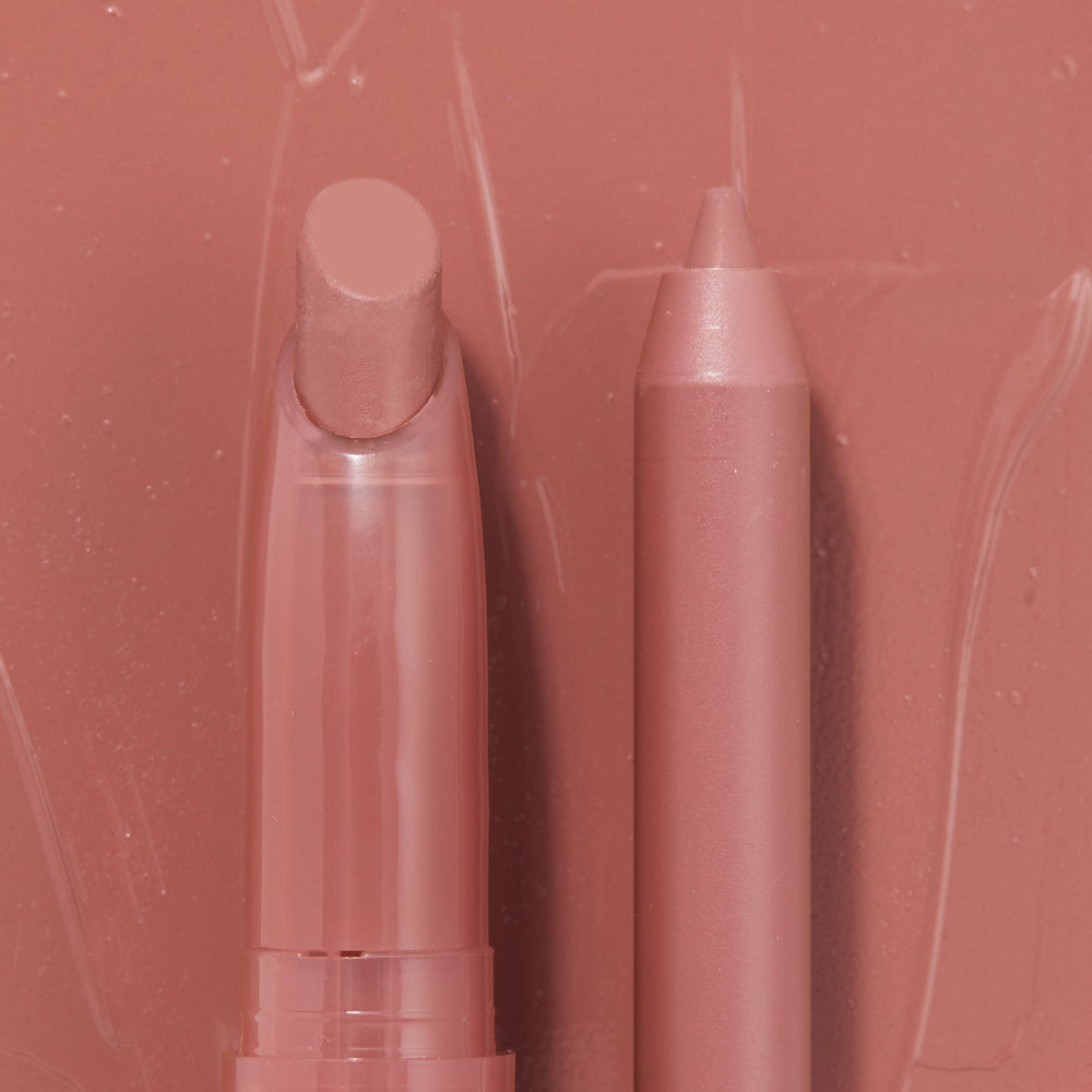 Double the Trouble ColourPop Lippie Stix + Pencil Set shown side by side in a warm rosy nude; the twist-up Lippie Stix and matching precision pencil rest on a glossy pink swatched backdrop, highlighting the coordinated shade for lining and filling lips.