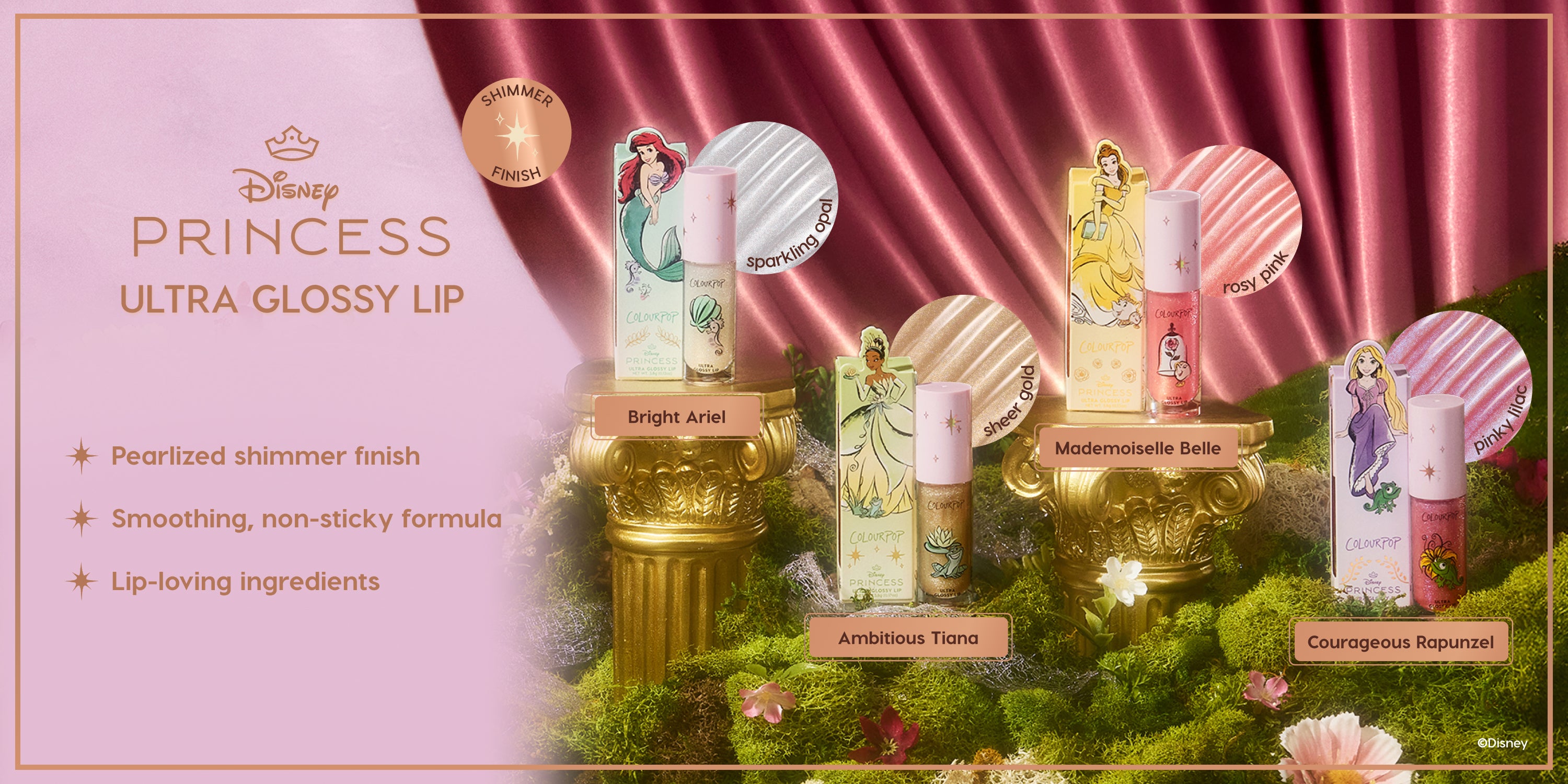 Colourpop Disney Princess Ultra Glossy Lip collection displayed on gold pedestals over moss, featuring Bright Ariel, Ambitious Tiana, Mademoiselle Belle, and Courageous Rapunzel shades with pearlized shimmer finish and non-sticky formula.
