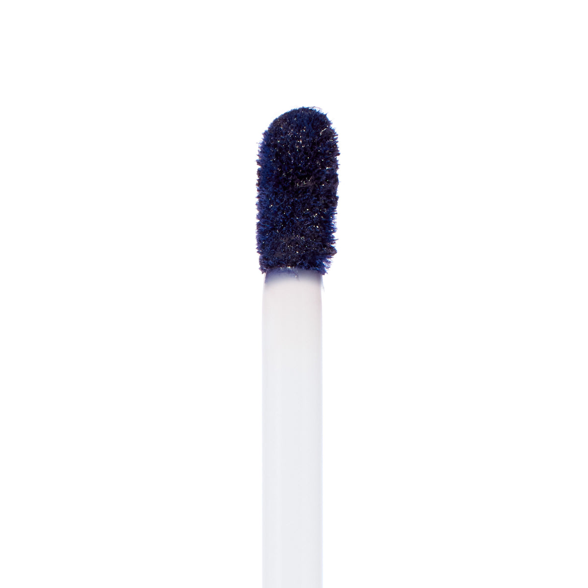Doe-foot applicator coated in Panther, a deep midnight navy ColourPop Ultra Matte Lip, showcasing the velvety matte formula on a white wand against a clean white background.