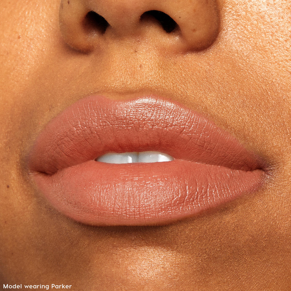 Lips wearing Parker, a warm nude-mauve shade, showing a soft matte cream finish from ColourPop Lippie Stix, featured in The Lil Box of Lippie Stix, captured in a tight close-up for color payoff and texture detail.